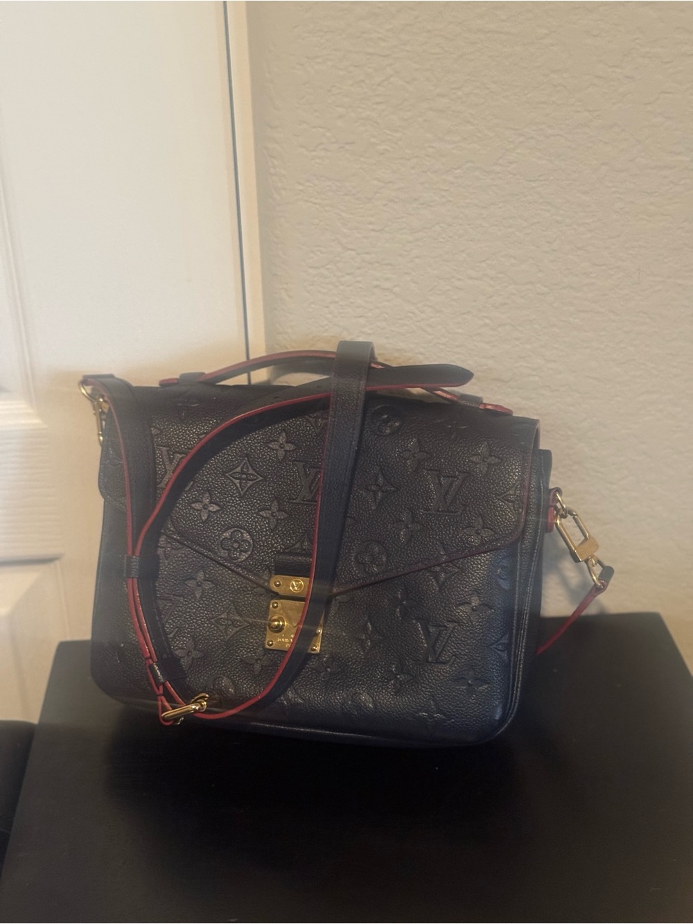 Used Louis Vuitton Navy Crossbody Bag Embossed Monogram Pattern and Gold Clasp